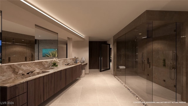 bathroom featuring tile patterned flooring, vanity, and walk in shower