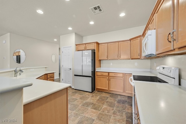 kitchen with sink, tile patterned flooring, and white appliances