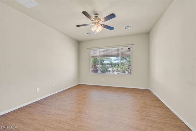 empty room featuring light wood-type flooring and ceiling fan