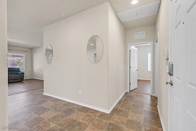 hallway featuring tile patterned floors