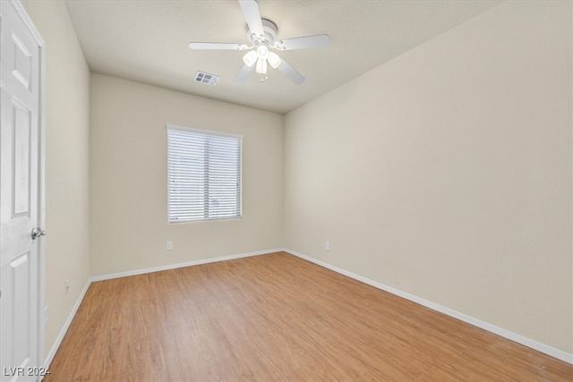 unfurnished room featuring ceiling fan and light wood-type flooring