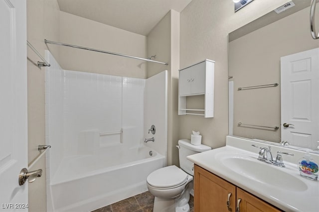 full bathroom with tile patterned floors, vanity, shower / washtub combination, and toilet