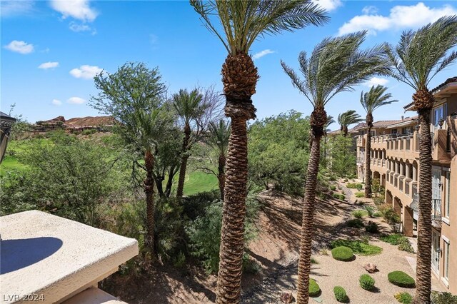 view of yard with a balcony