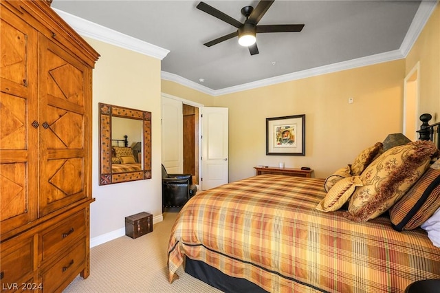 carpeted bedroom with ornamental molding and ceiling fan