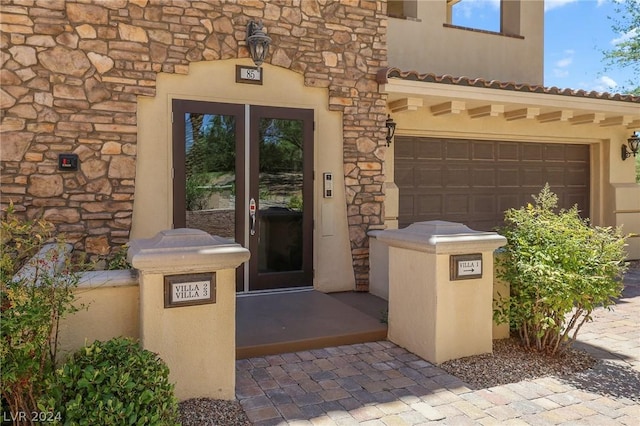 entrance to property featuring a garage