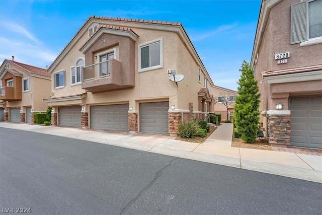 townhome / multi-family property featuring a garage