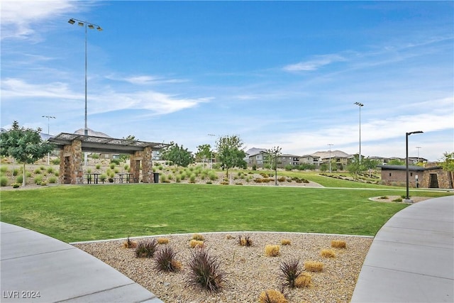 surrounding community featuring a gazebo and a lawn