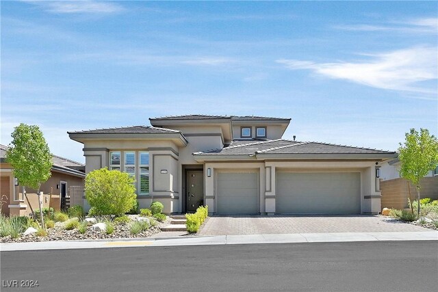 prairie-style home featuring a garage