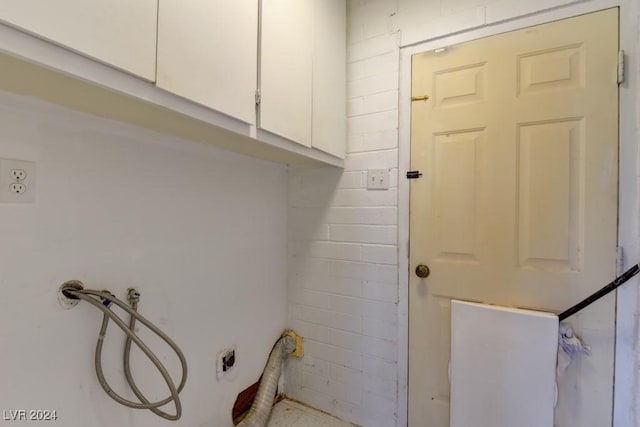 washroom with washer hookup, cabinet space, and hookup for an electric dryer