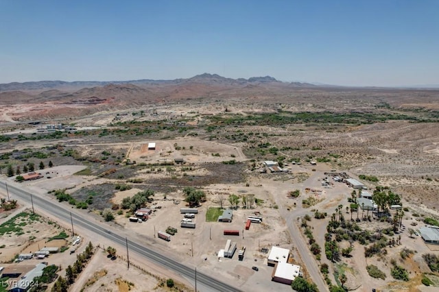 birds eye view of property featuring a desert view and a mountain view