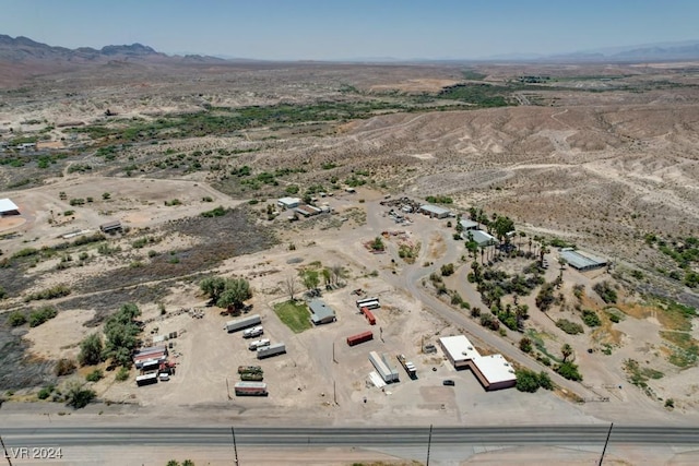 birds eye view of property with a desert view and a mountain view