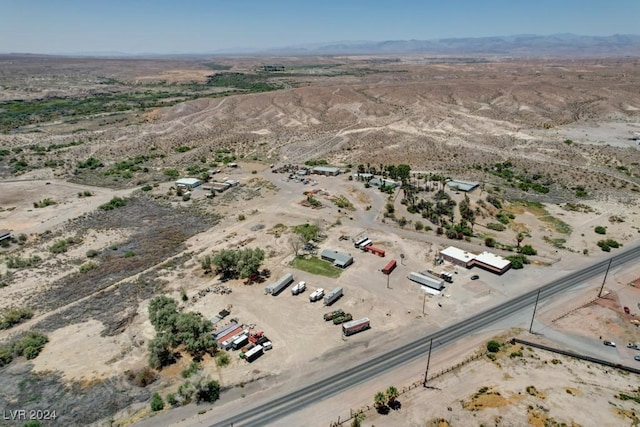 bird's eye view featuring view of desert, a rural view, and a mountain view