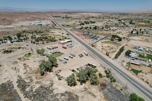 aerial view with view of desert, a rural view, and a mountain view