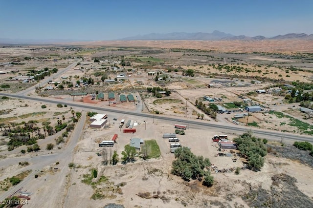 aerial view featuring a rural view, a desert view, and a mountain view