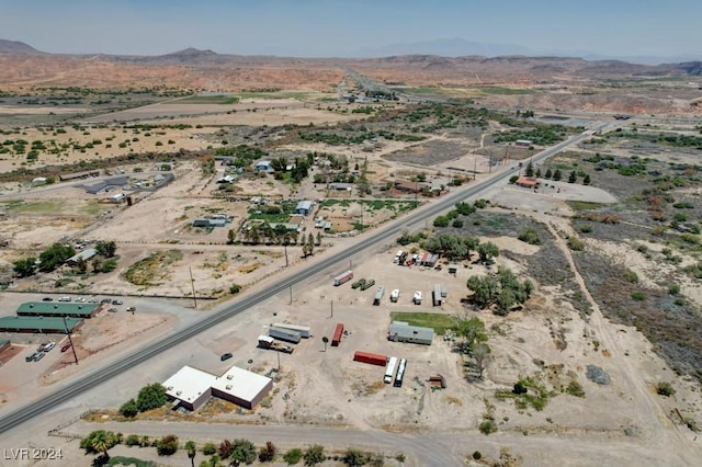 drone / aerial view with a rural view, a desert view, and a mountain view