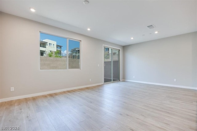 unfurnished room with light hardwood / wood-style flooring