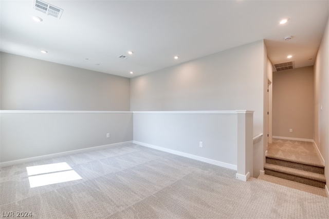 empty room featuring light colored carpet