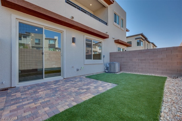 view of yard featuring a patio and central AC