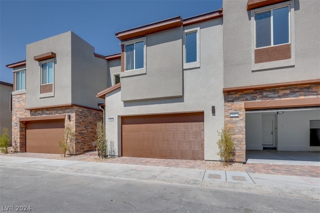 townhome / multi-family property featuring a garage