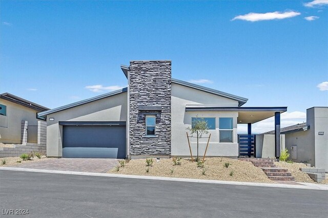 view of front of property with a garage