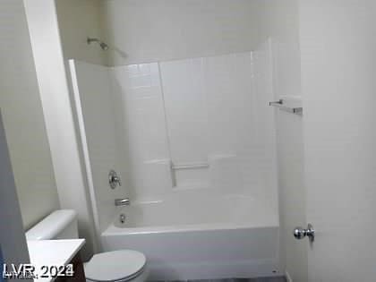 full bathroom featuring vanity, shower / tub combination, and toilet