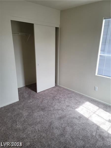 4085 Oliver Sagebrush Dr, Las Vegas, NV 89122 - unfurnished bedroom with carpet floors and a closet
