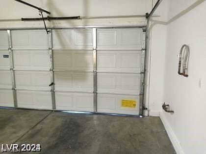 4085 Oliver Sagebrush Dr, Las Vegas, NV 89122 - garage featuring baseboards
