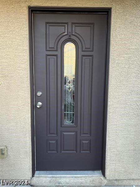 4085 Oliver Sagebrush Dr, Las Vegas, NV 89122 - property entrance with stucco siding
