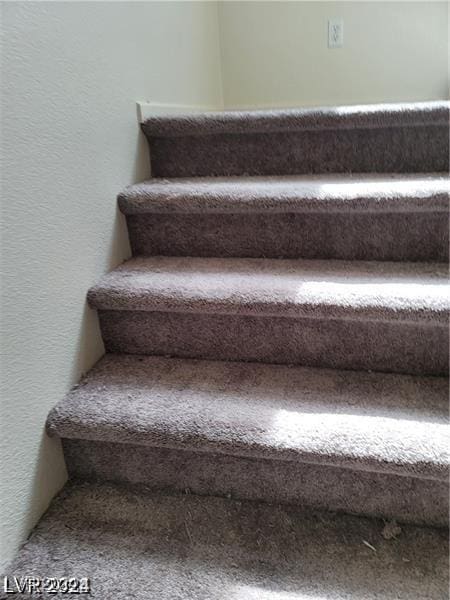 4085 Oliver Sagebrush Dr, Las Vegas, NV 89122 - stairway featuring a textured wall