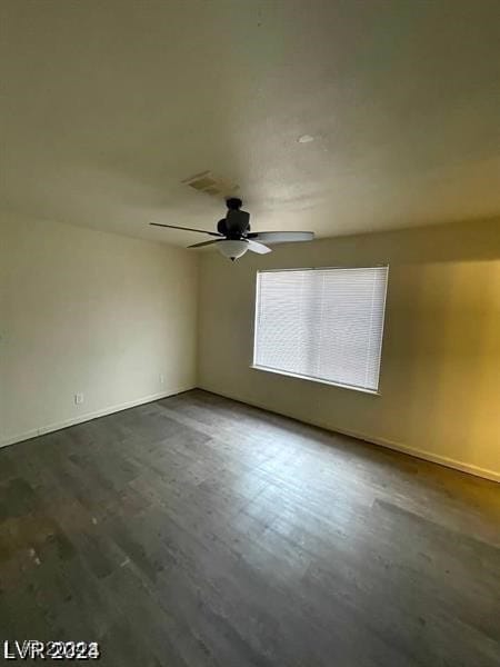 spare room featuring hardwood / wood-style flooring and ceiling fan