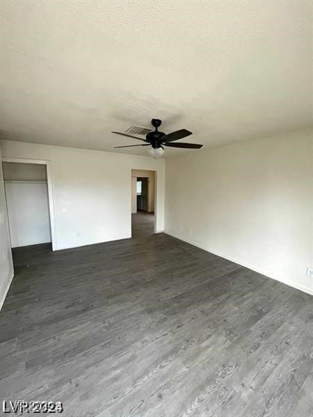 unfurnished living room featuring wood-type flooring and ceiling fan