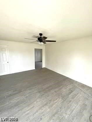 unfurnished living room featuring hardwood / wood-style floors and ceiling fan