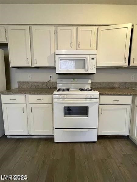 kitchen with white cabinetry, white appliances, and dark wood-type flooring