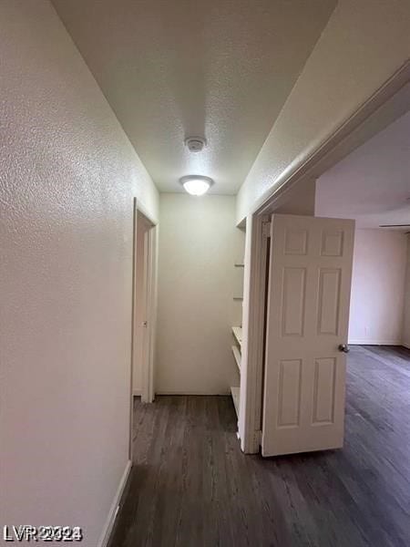 hall with dark hardwood / wood-style flooring