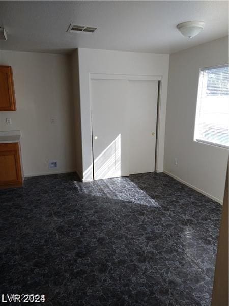 interior space with dark colored carpet