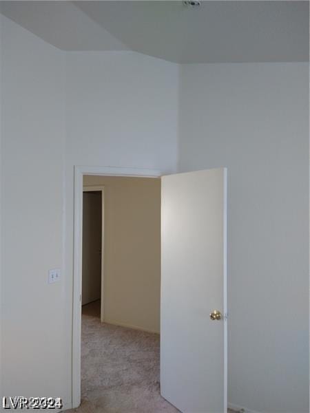 empty room featuring light colored carpet