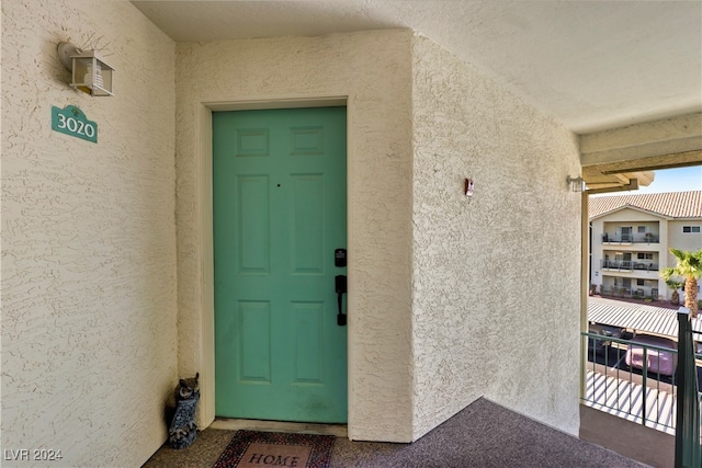 doorway to property with a balcony