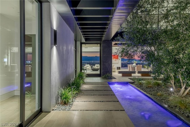 patio terrace at dusk with a pool