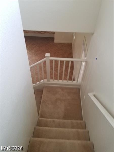 stairs featuring carpet