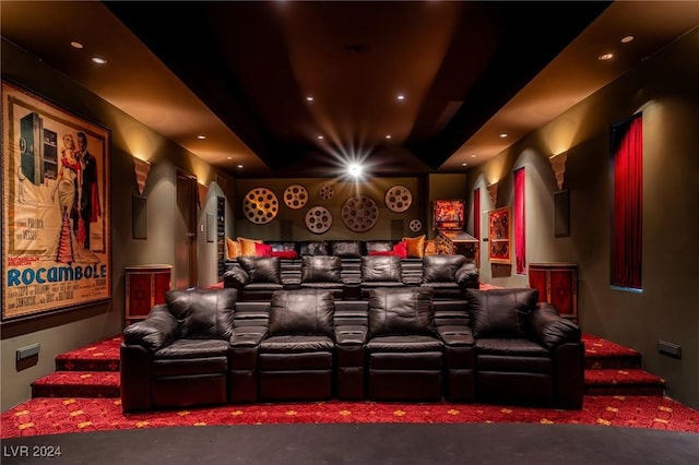 home theater with recessed lighting and a tray ceiling