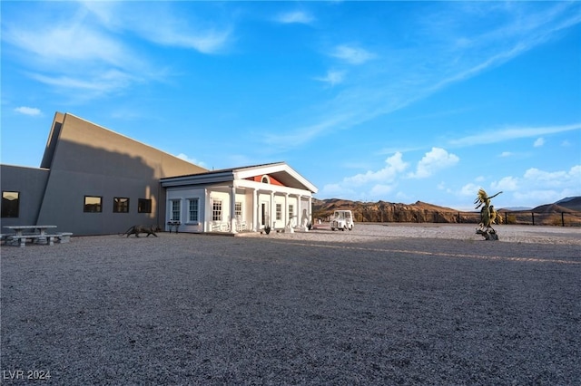 rear view of house with stucco siding