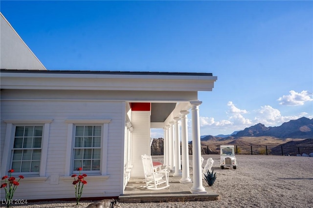 entrance to property featuring fence and a mountain view