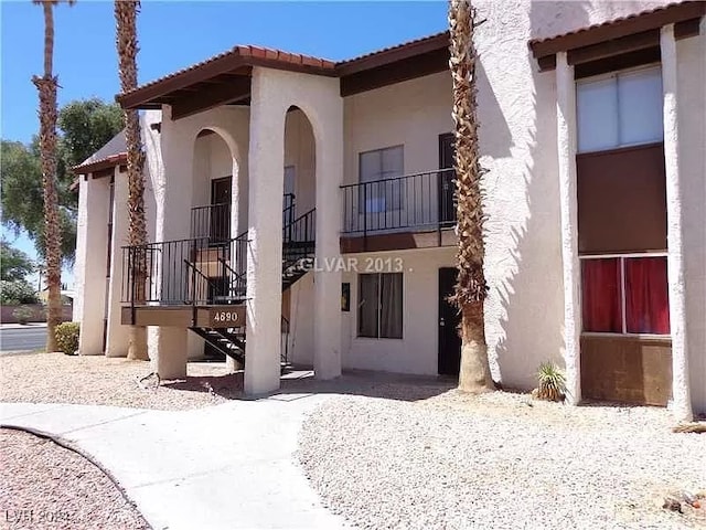 view of property with stairway