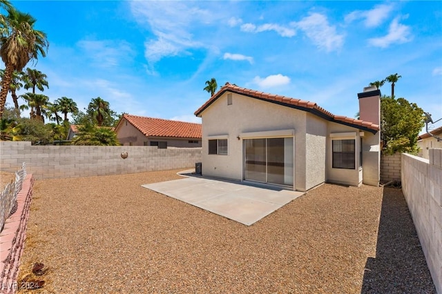 back of property featuring a patio