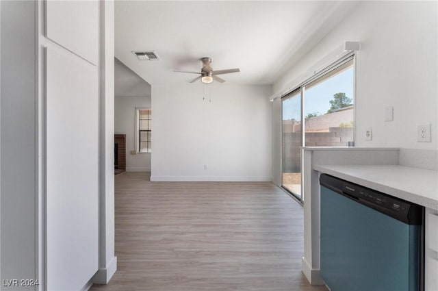 kitchen with a brick fireplace, light hardwood / wood-style flooring, stainless steel dishwasher, and ceiling fan