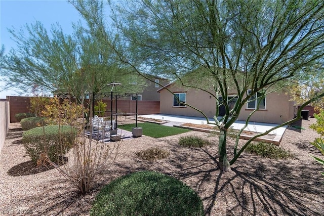 view of yard featuring a patio area and a fenced backyard