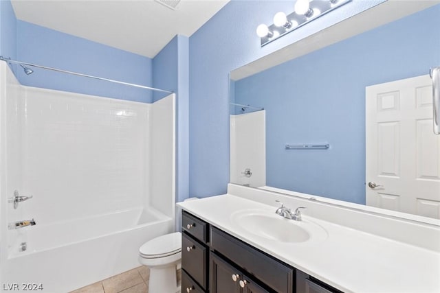 full bath featuring toilet, tile patterned flooring, vanity, and shower / bathtub combination