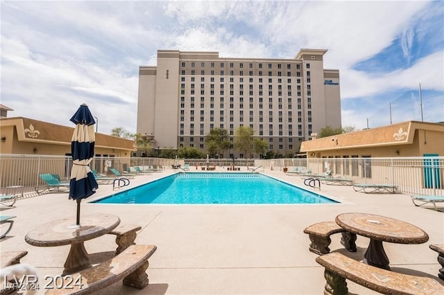 view of swimming pool with a patio