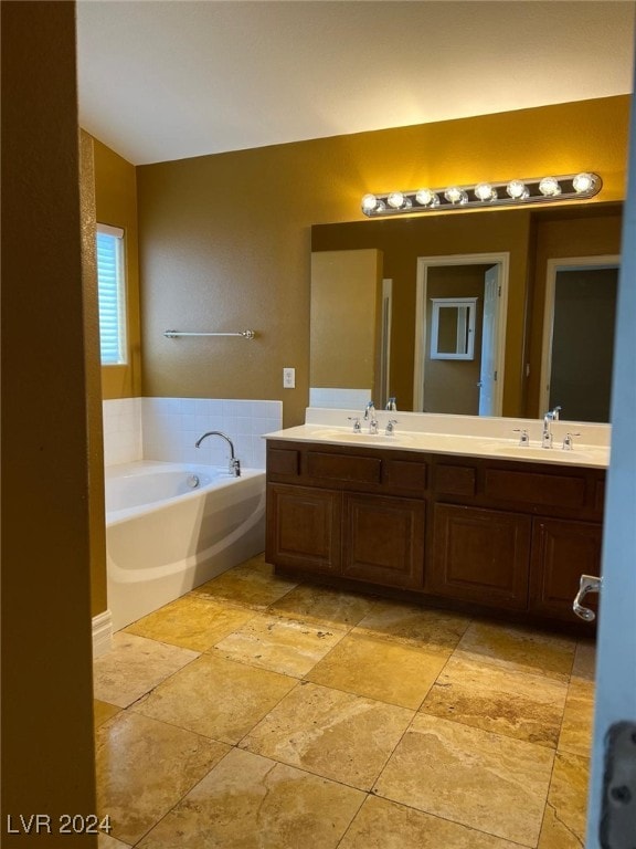 bathroom featuring vanity and a bathtub