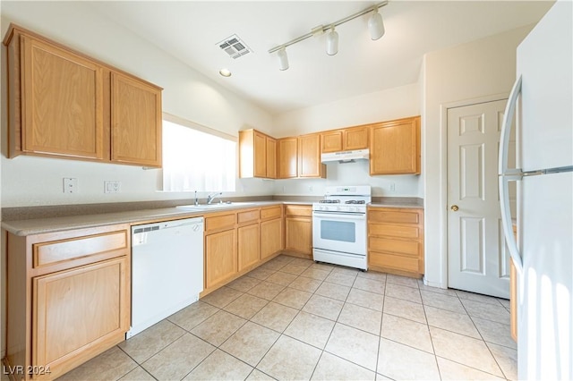 kitchen featuring visible vents, white appliances, light countertops, and under cabinet range hood